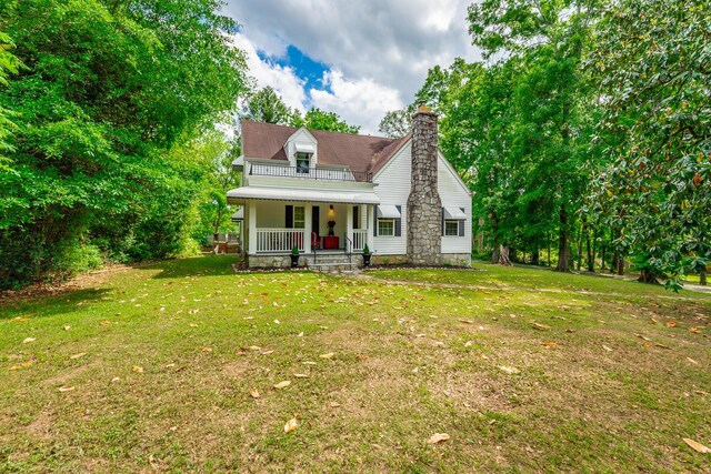 204 Lee-Gordon Mill Rd, Chickamauga, GA 30707 - view of front of home featuring covered porch, a front lawn, and a chimney