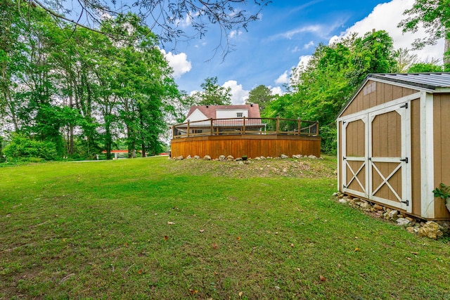 204 Lee-Gordon Mill Rd, Chickamauga, GA 30707 - view of green lawn with a storage shed, an outbuilding, and a wooden deck