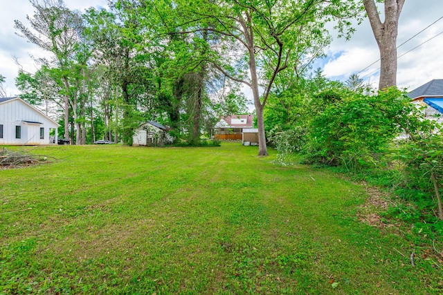 204 Lee-Gordon Mill Rd, Chickamauga, GA 30707 - view of green lawn featuring a storage shed and an outbuilding