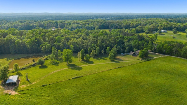 aerial view with a wooded view and a rural view