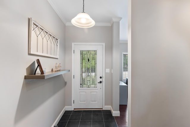 doorway with dark tile patterned floors, ornamental molding, and baseboards