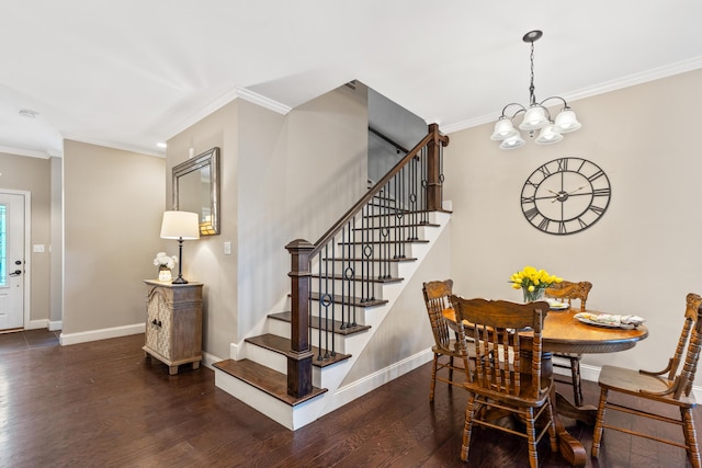 dining space with baseboards, wood finished floors, a notable chandelier, and stairway