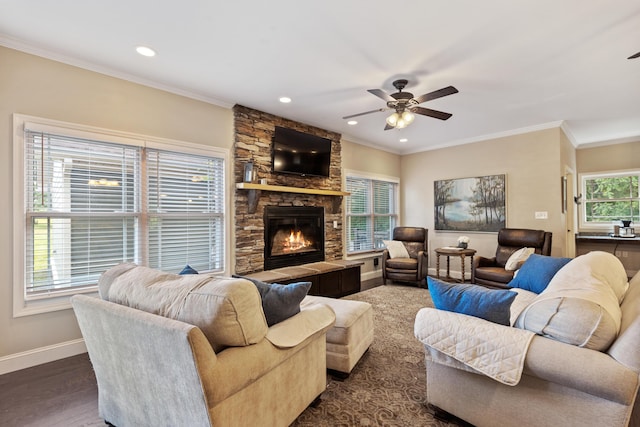 living room featuring baseboards, a ceiling fan, a fireplace, and recessed lighting