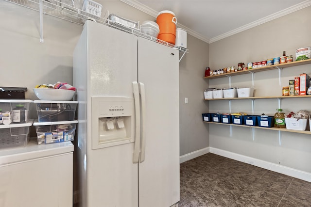 laundry area featuring baseboards and ornamental molding