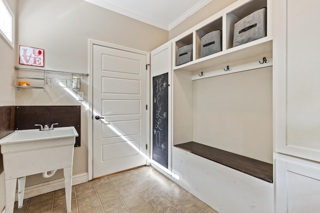 mudroom featuring crown molding