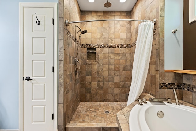 full bath with a shower stall and a garden tub