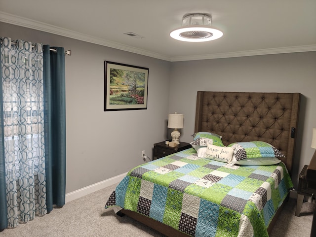 carpeted bedroom featuring baseboards, ornamental molding, and visible vents