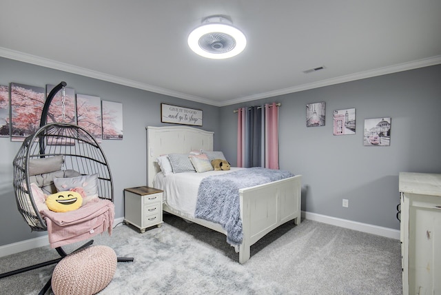 bedroom featuring crown molding, baseboards, and carpet floors