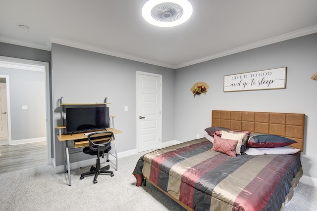 bedroom featuring carpet floors, baseboards, and ornamental molding