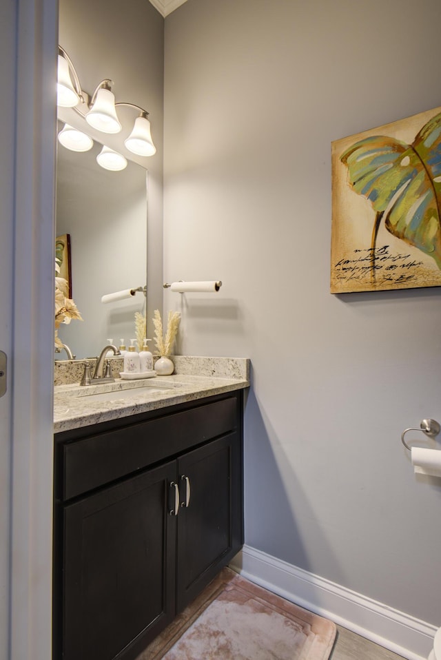 bathroom with vanity and baseboards