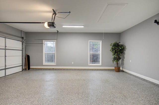 garage with baseboards and a garage door opener