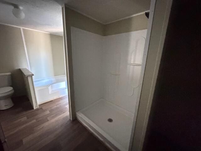 401 Old Cottonwood Mill Rd, Tunnel Hill, GA 30755 - full bathroom with a stall shower, toilet, and wood finished floors