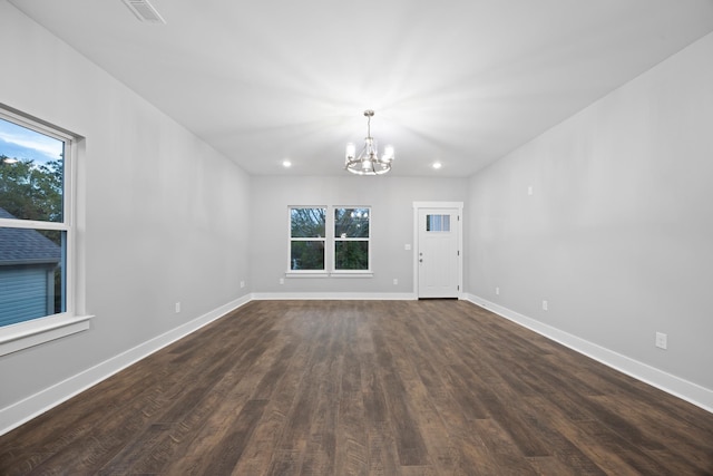 interior space with visible vents, dark wood-style flooring, baseboards, recessed lighting, and a chandelier