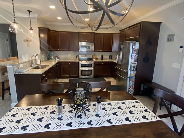 kitchen with a sink, stainless steel appliances, ornamental molding, dark brown cabinetry, and light stone countertops