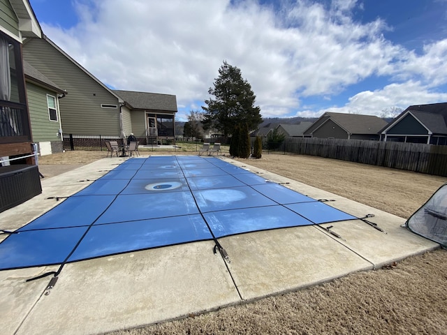 view of pool featuring a patio area, a fenced in pool, and a fenced backyard