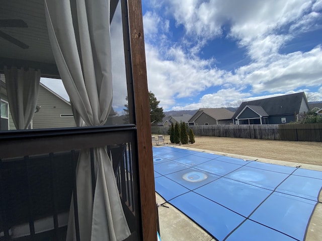 view of pool featuring a residential view and a fenced backyard