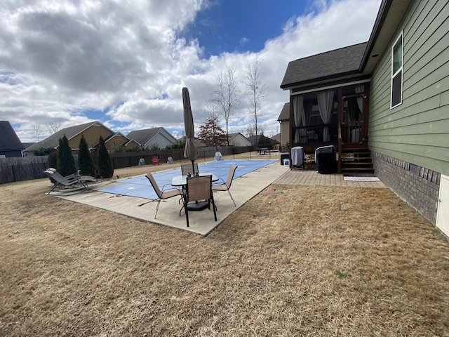 view of swimming pool with a patio and a fenced backyard