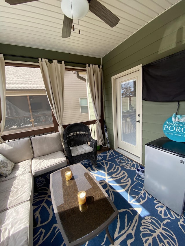 sunroom with a ceiling fan