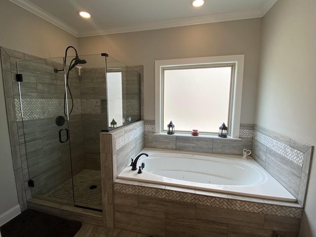 bathroom featuring a tub with jets, a shower stall, ornamental molding, and recessed lighting