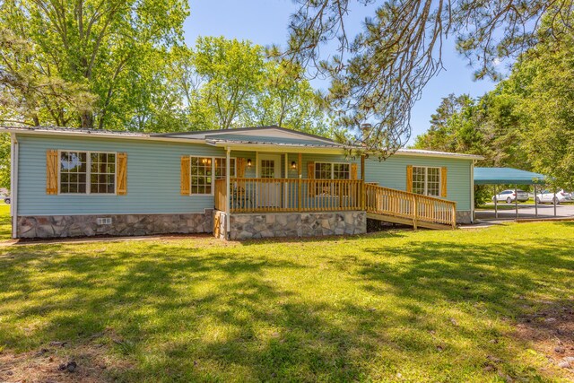 229 General Thomas St, Chickamauga, GA 30707 - back of property featuring crawl space, a lawn, covered porch, and a detached carport