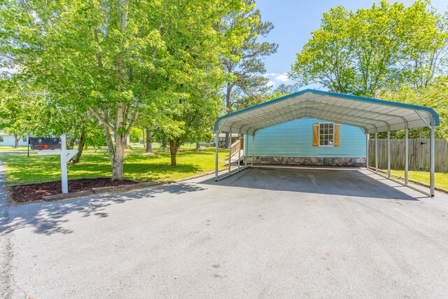229 General Thomas St, Chickamauga, GA 30707 - view of car parking with asphalt driveway and a detached carport