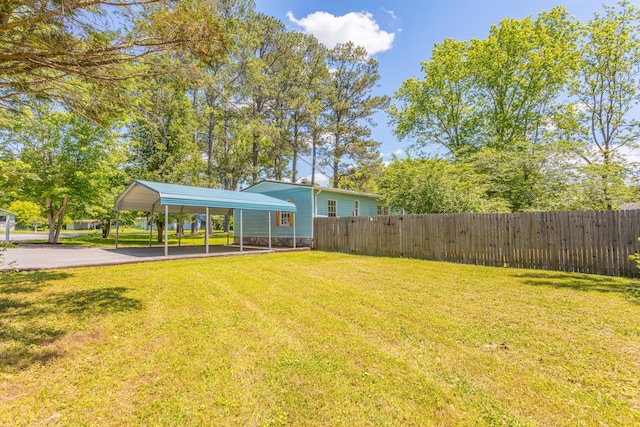 229 General Thomas St, Chickamauga, GA 30707 - view of yard with a carport and asphalt driveway