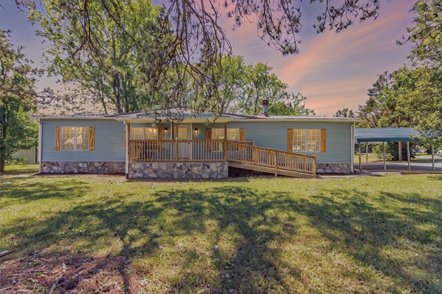 229 General Thomas St, Chickamauga, GA 30707 - back of property featuring a lawn, a carport, and a deck