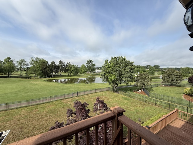 view of yard featuring a fenced backyard and a water view