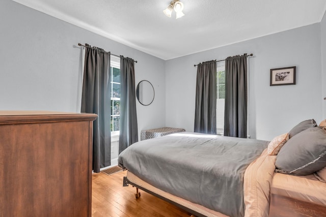 bedroom featuring light wood finished floors