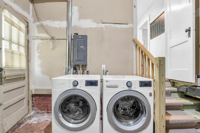 clothes washing area with independent washer and dryer and electric panel