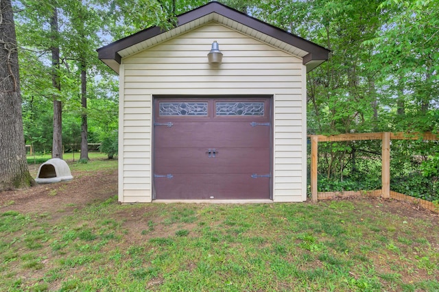 garage featuring a storage shed