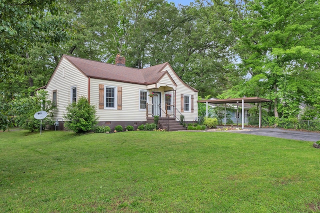 view of front facade with crawl space, driveway, a chimney, a front yard, and a carport