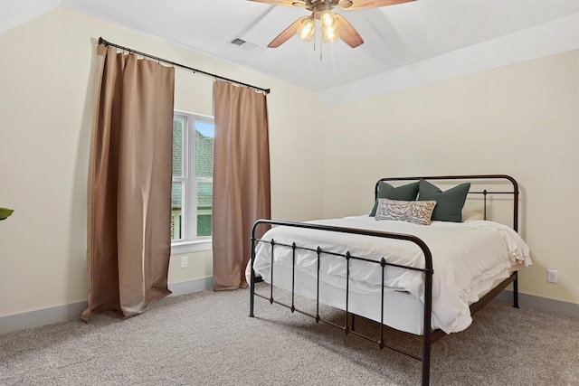 bedroom featuring visible vents, carpet flooring, baseboards, and ceiling fan