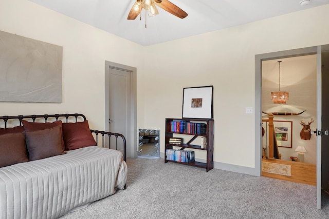 carpeted bedroom with a ceiling fan