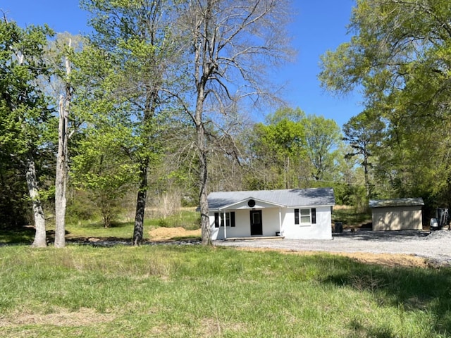 5561 River Rd, Decatur, TN 37322 - back of house featuring a porch and an outbuilding