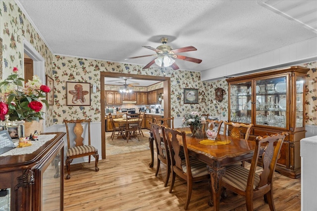 4042 Village Dr, Cohutta, GA 30710 - dining area featuring ceiling fan, light wood-style flooring, wallpapered walls, and a textured ceiling