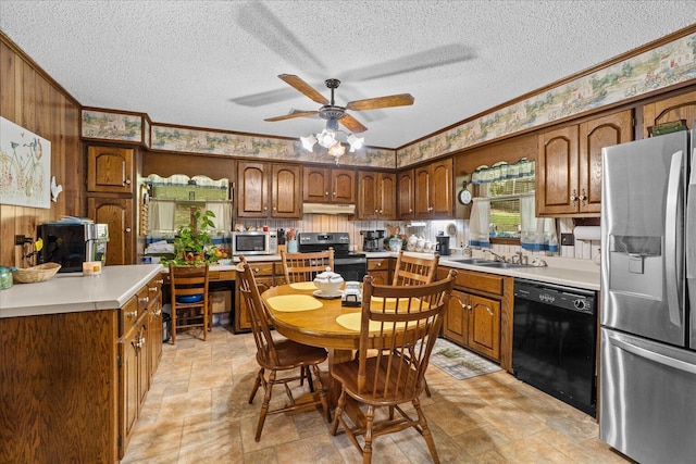 4042 Village Dr, Cohutta, GA 30710 - kitchen featuring a textured ceiling, ornamental molding, ceiling fan, a sink, and appliances with stainless steel finishes