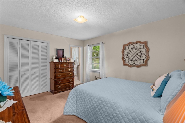 4042 Village Dr, Cohutta, GA 30710 - carpeted bedroom featuring a closet and a textured ceiling