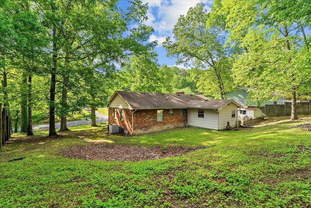 4042 Village Dr, Cohutta, GA 30710 - rear view of property with fence, brick siding, and a lawn