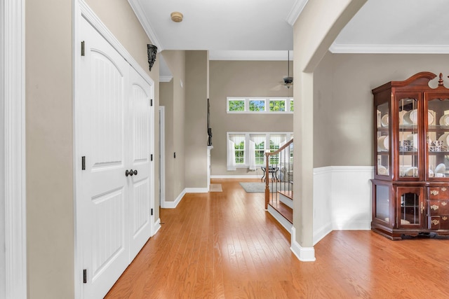 8358 Front Gate Cir, Ooltewah, TN 37363 - entryway featuring a ceiling fan, light wood finished floors, stairway, baseboards, and ornamental molding