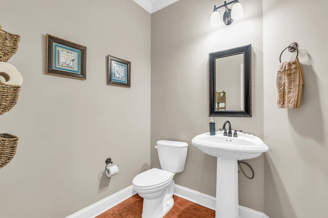 8358 Front Gate Cir, Ooltewah, TN 37363 - half bathroom with baseboards, toilet, ornamental molding, and wood finished floors
