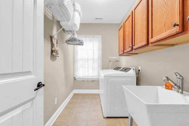 8358 Front Gate Cir, Ooltewah, TN 37363 - washroom with cabinet space, separate washer and dryer, light tile patterned floors, and baseboards