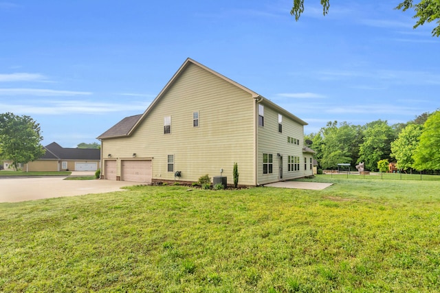 8358 Front Gate Cir, Ooltewah, TN 37363 - view of side of home featuring an attached garage, concrete driveway, and cooling unit