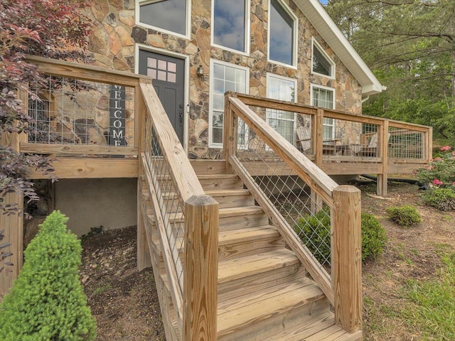 wooden deck featuring stairs
