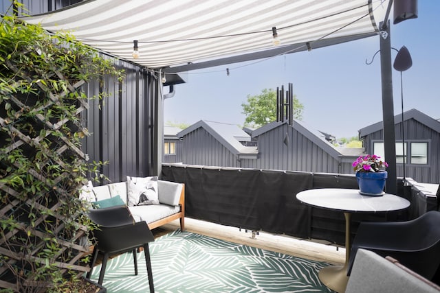 view of patio featuring a balcony