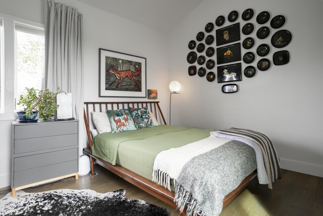 bedroom with wood finished floors