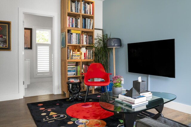 playroom featuring wood finished floors and baseboards