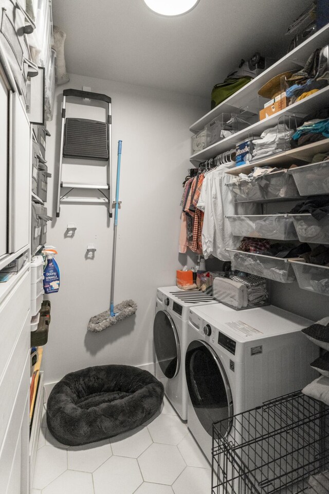 laundry room with washing machine and clothes dryer