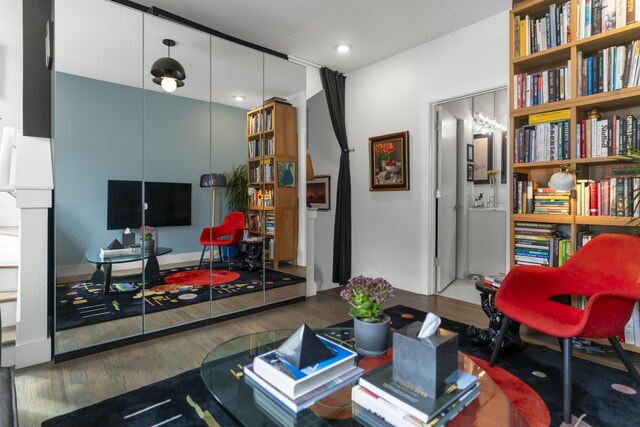 living room with wood finished floors and baseboards