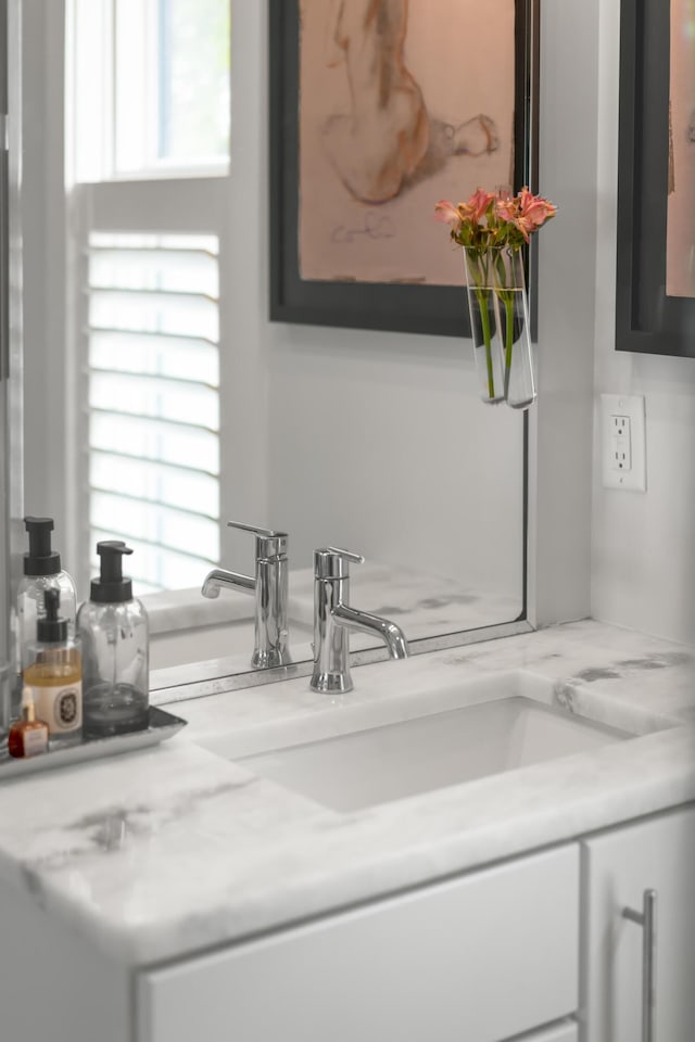 bathroom featuring healthy amount of natural light and vanity